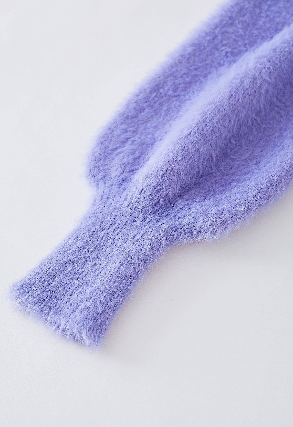 Cardigan en tricot flou nacré ouvert sur le devant en bleu