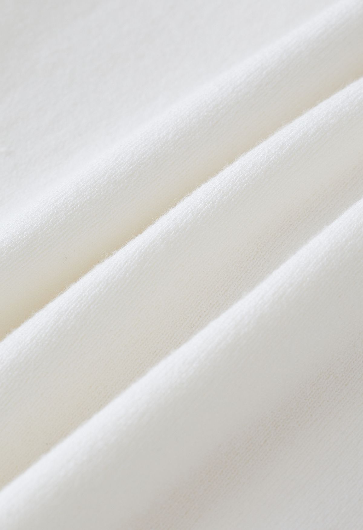 Haut deux pièces en faux tricot à devant torsadé en blanc