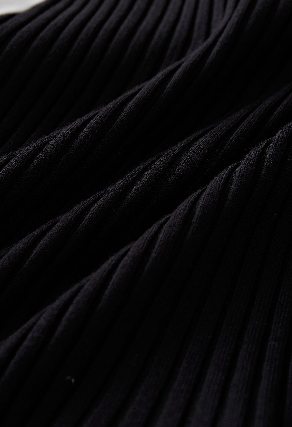 Chemise épissée asymétrique en tricot côtelé en noir