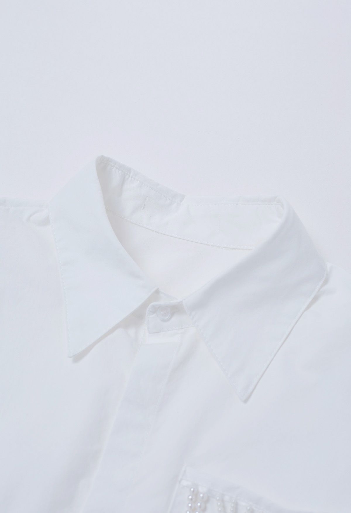 Chemise courte en coton à nouer à la taille et décorée de perles