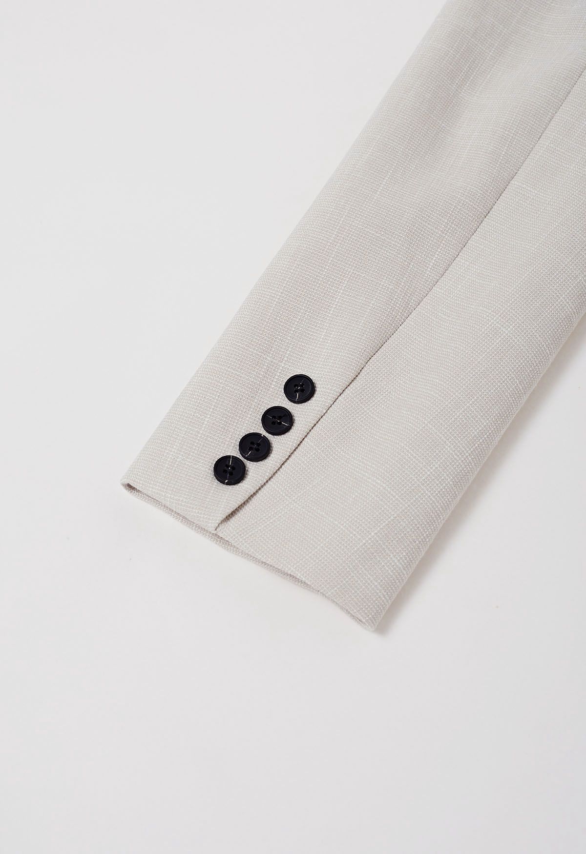 Blazer boutonné texturé avec poche plaquée en ivoire