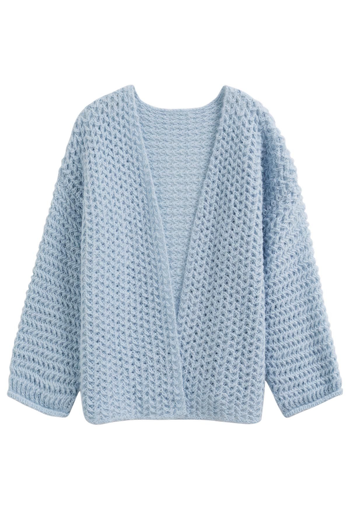 Cardigan en maille ajouré ouvert sur le devant en bleu