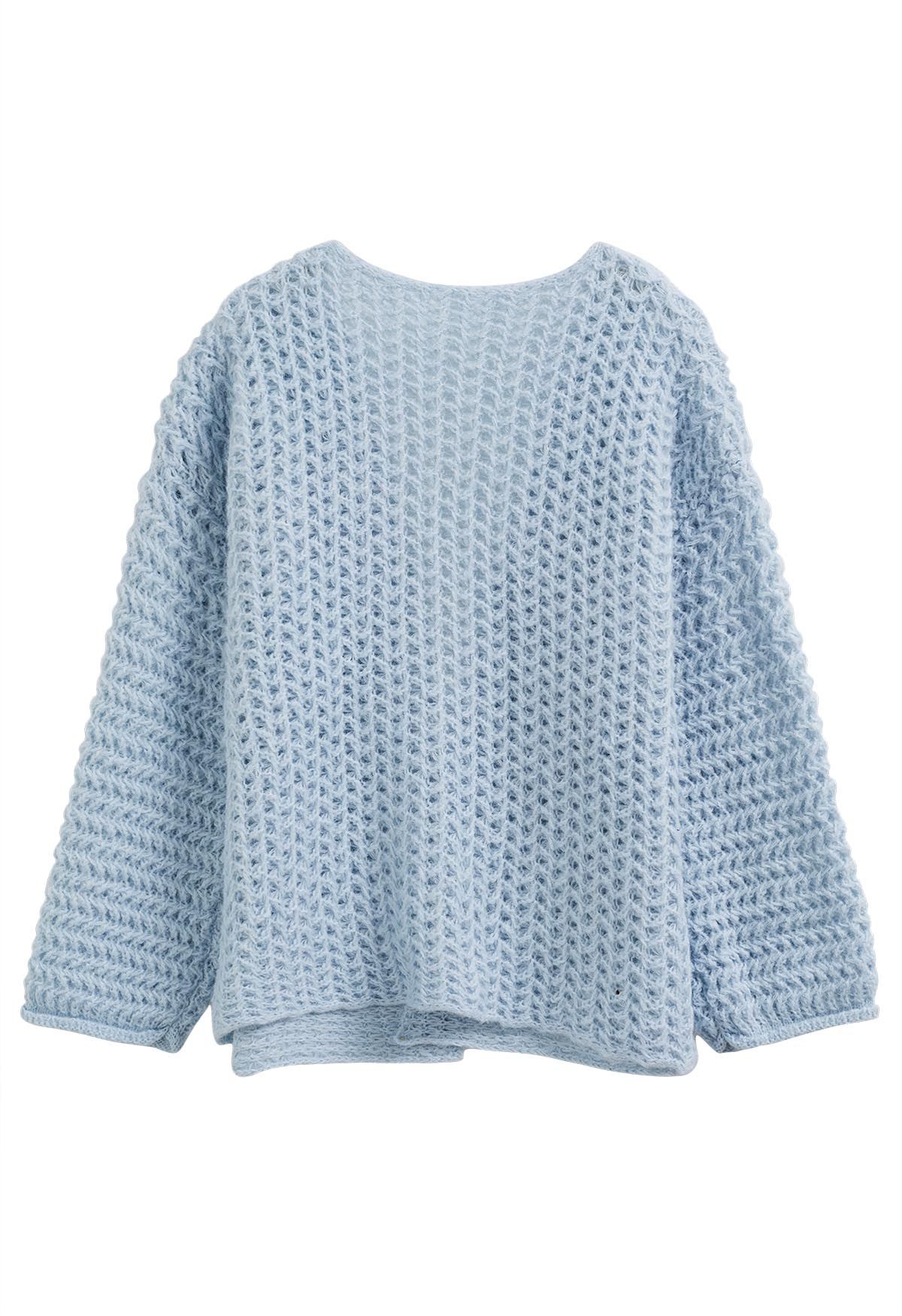 Cardigan en maille ajouré ouvert sur le devant en bleu