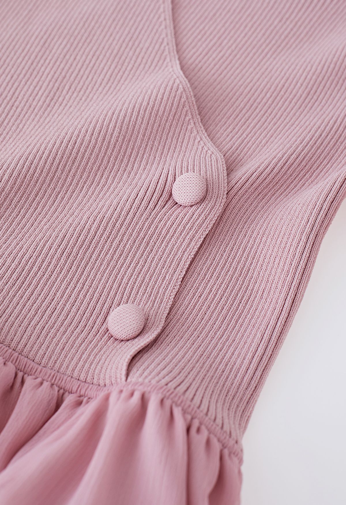 Robe mi-longue transparente en tricot épissé à col licou en rose