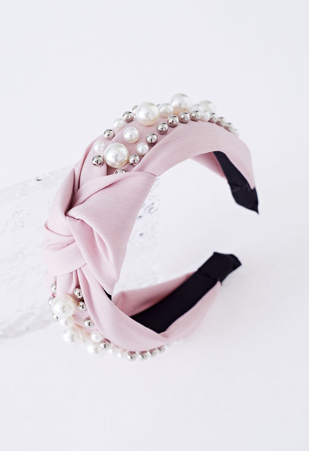 Bandeau en tissu perlé à décor de perles en rose