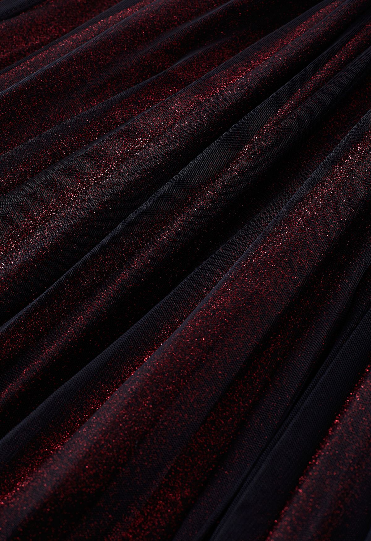 Jupe mi-longue en maille plissée scintillante en rouge