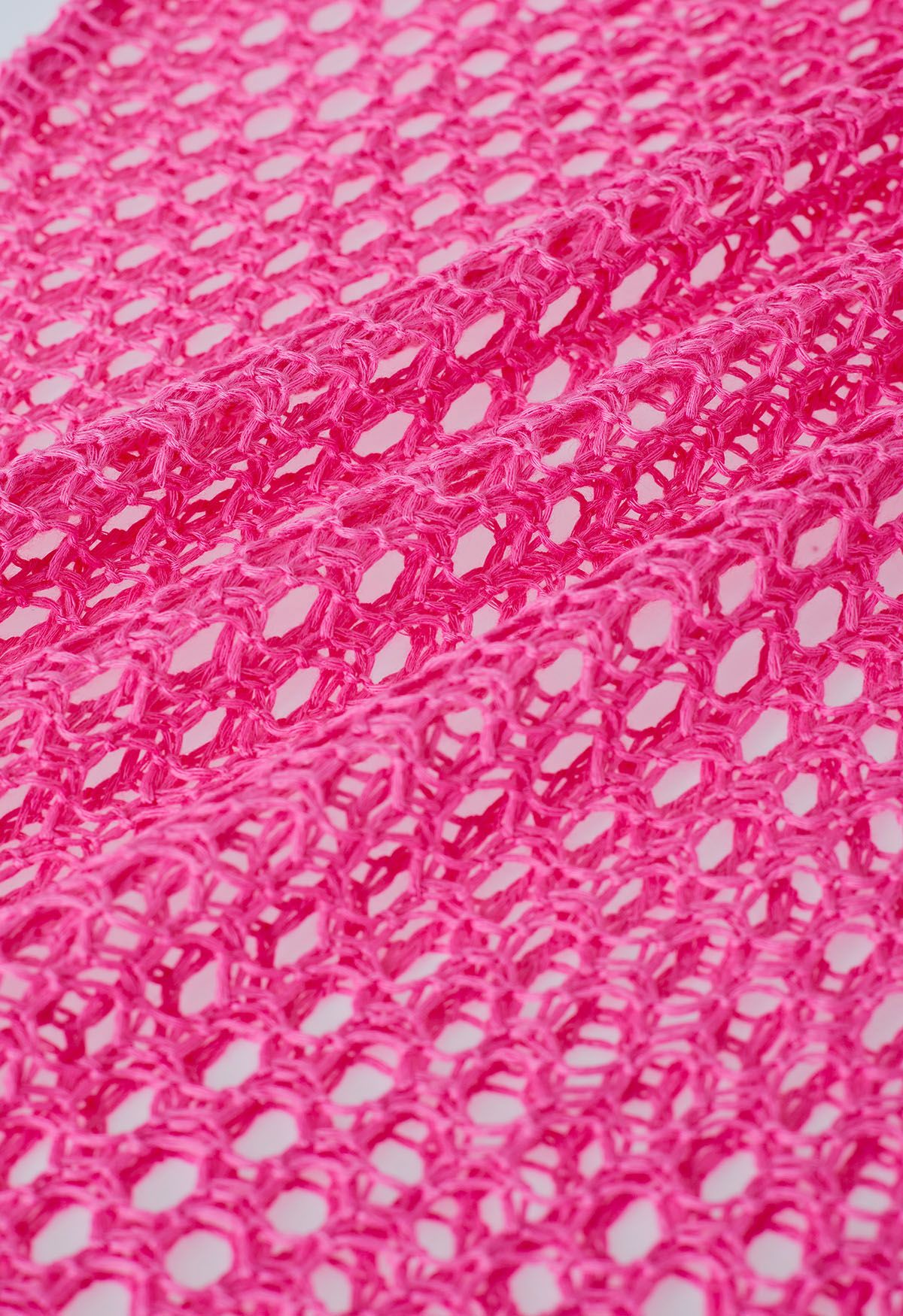 Couverture en tricot sans manches à ourlet à pampilles en rose vif