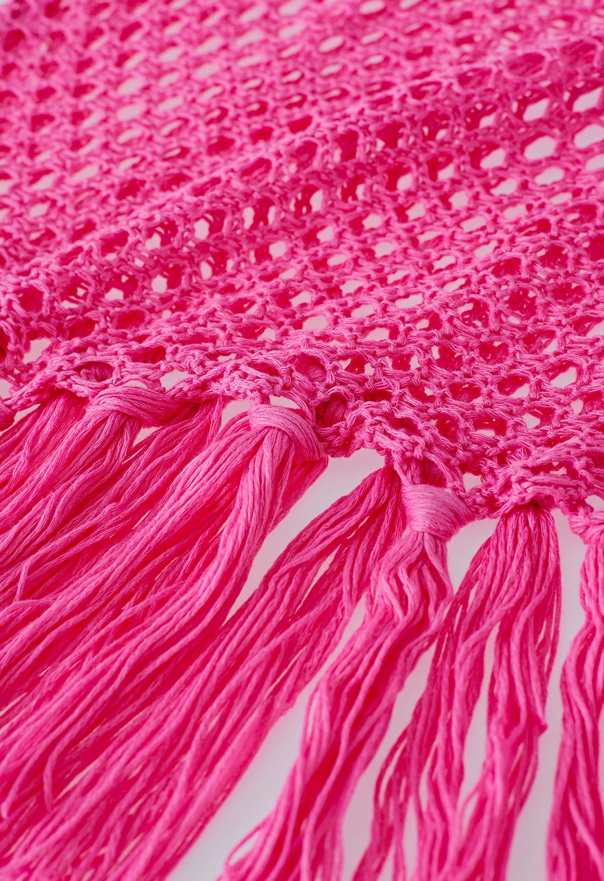 Couverture en tricot sans manches à ourlet à pampilles en rose vif