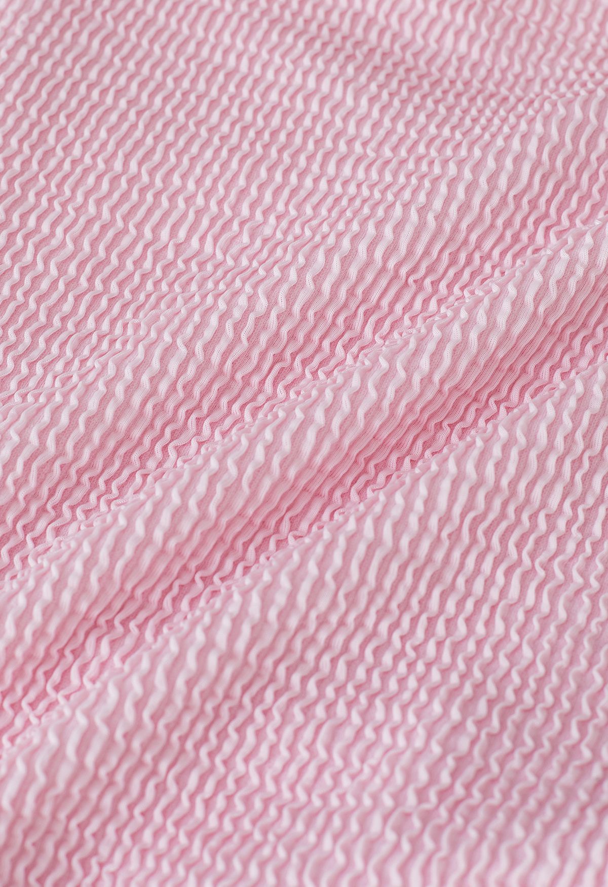 Maillot de bain texturé ondulé à découpe torsadée en rose