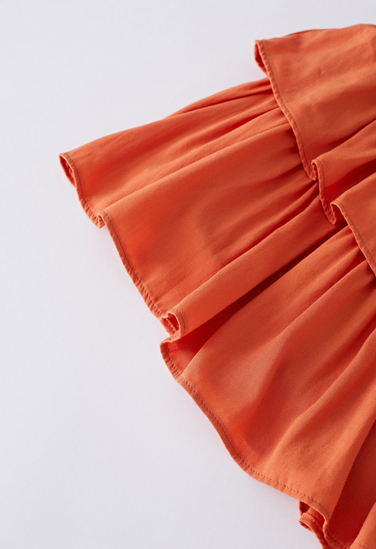 Mini-jupe froncée à volants et à volants en orange
