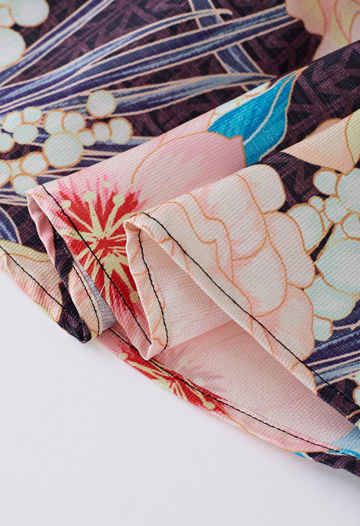Jupe mi-longue à imprimé floral métallisé lustré