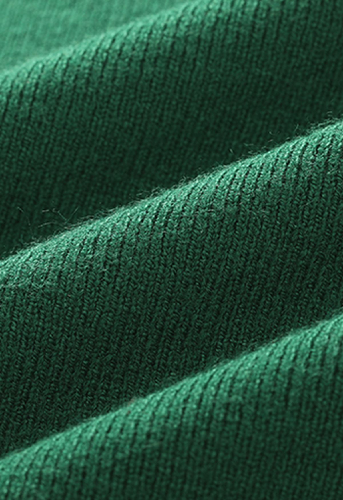 Haut en tricot sans manches à col montant orné de perles en vert foncé