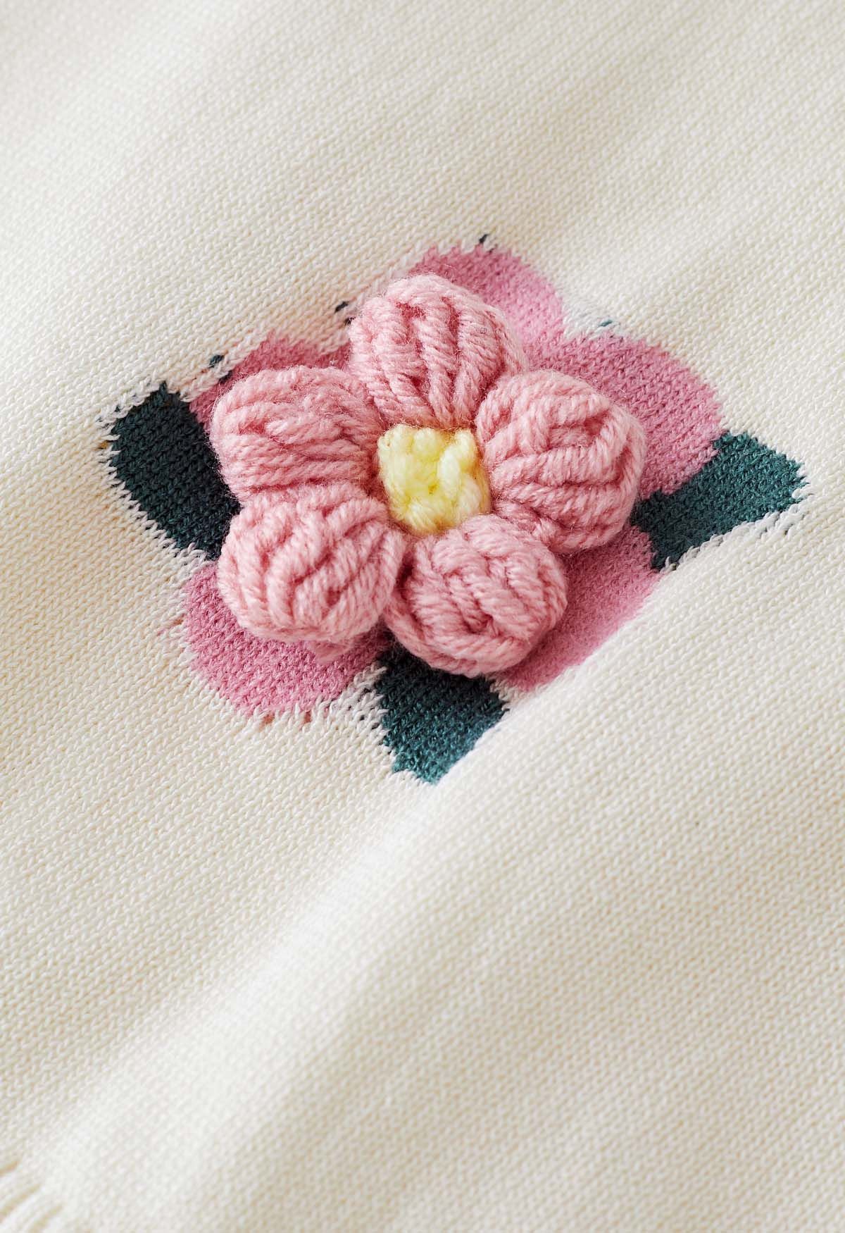 Haut en tricot à manches courtes et fleurs roses en crème