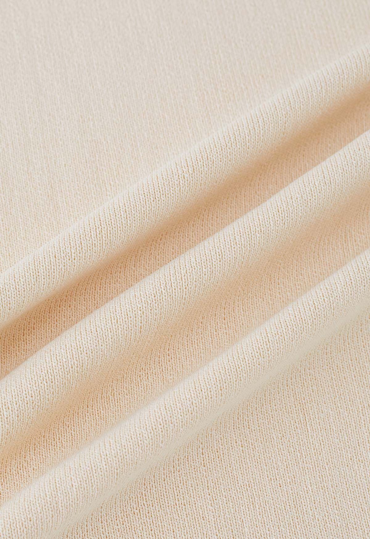 Robe moulante en tricot à encolure découpée en crème