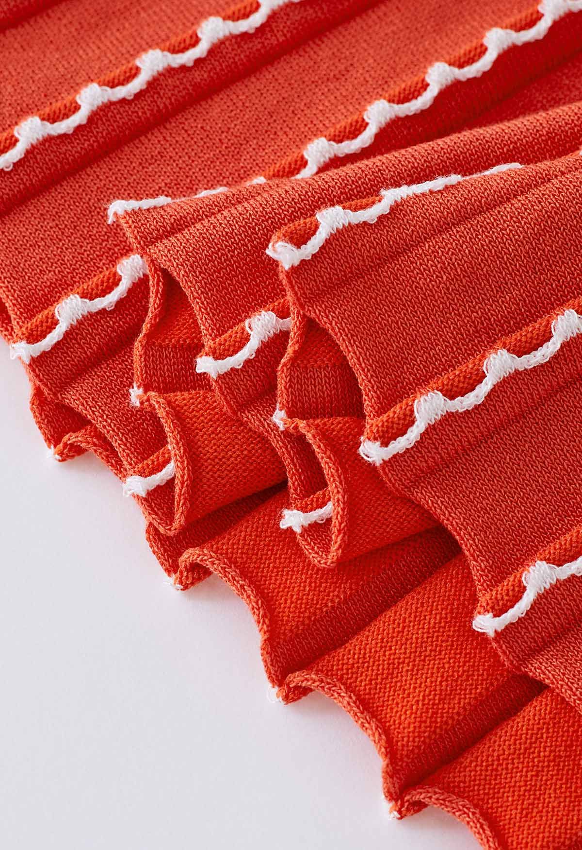 Robe en tricot sans manches à coutures ondulées en orange