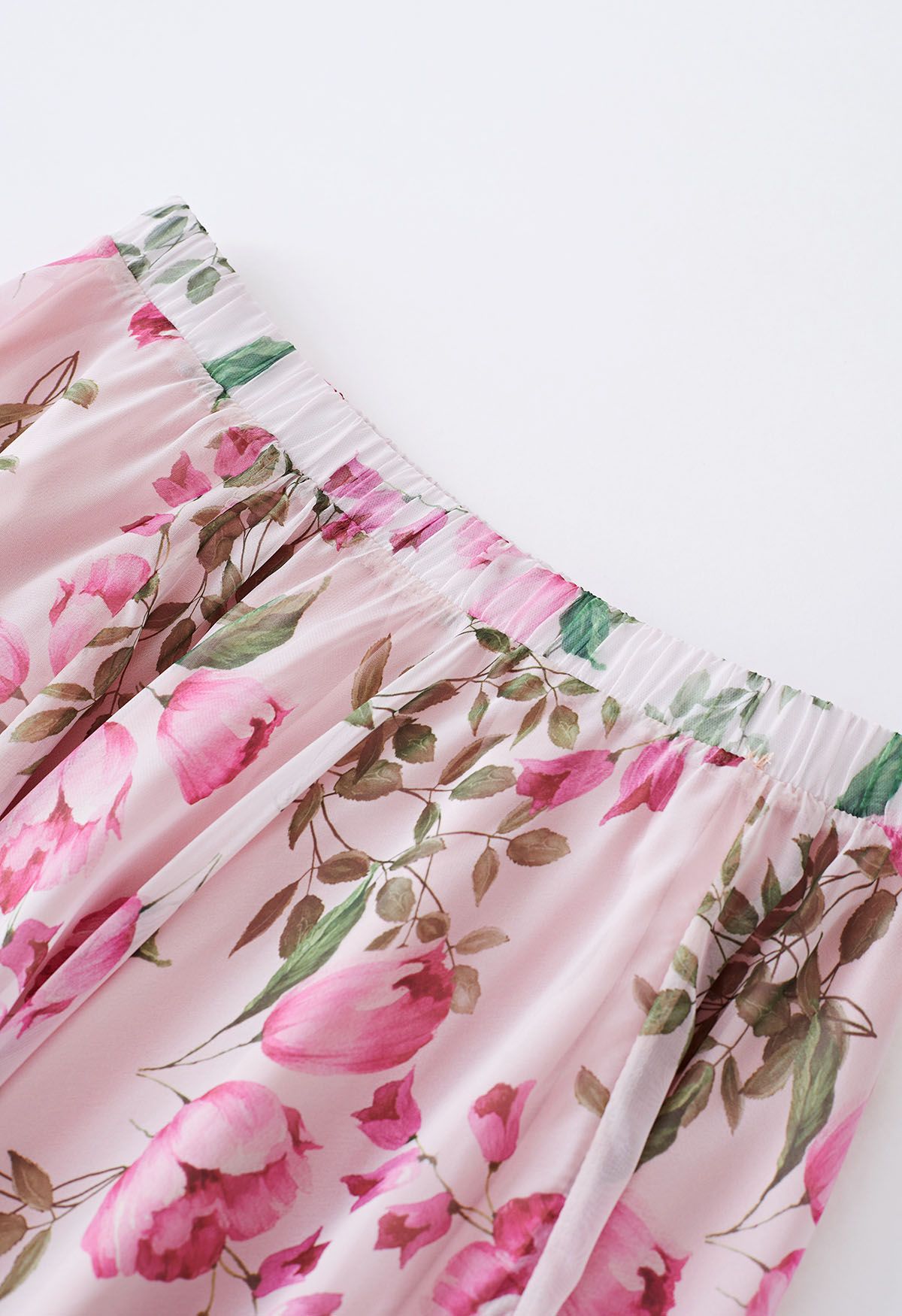 Jupe longue en mousseline de soie rose à imprimé de boutons de fleurs