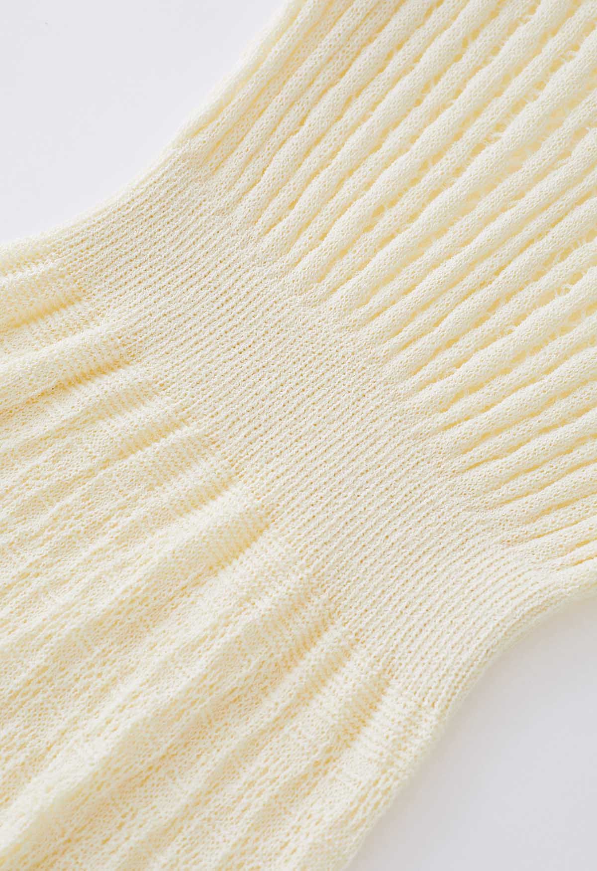 Couverture en tricot pointelle à manches flottantes en crème