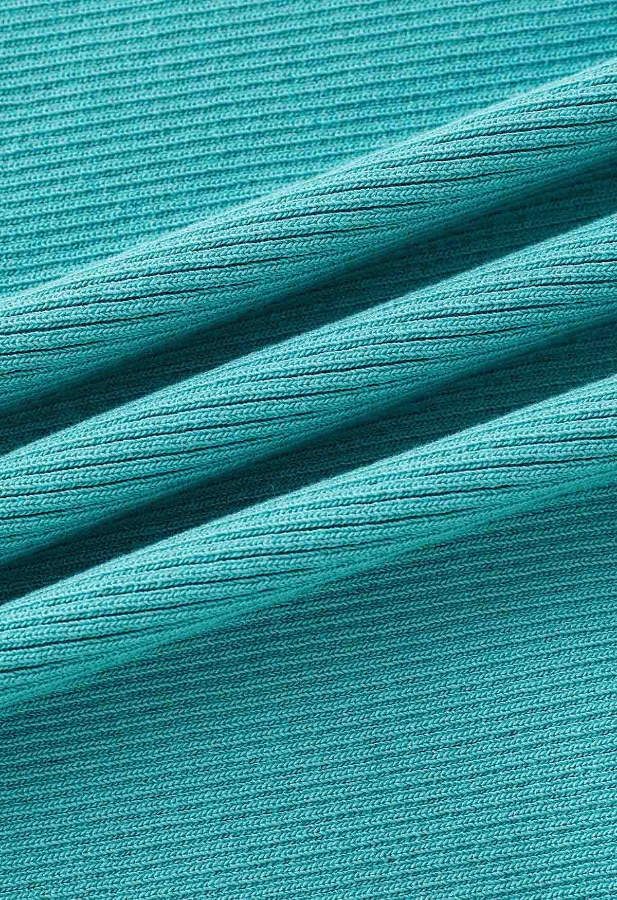 Robe caraco moulante en tricot torsadé sur le devant en turquoise