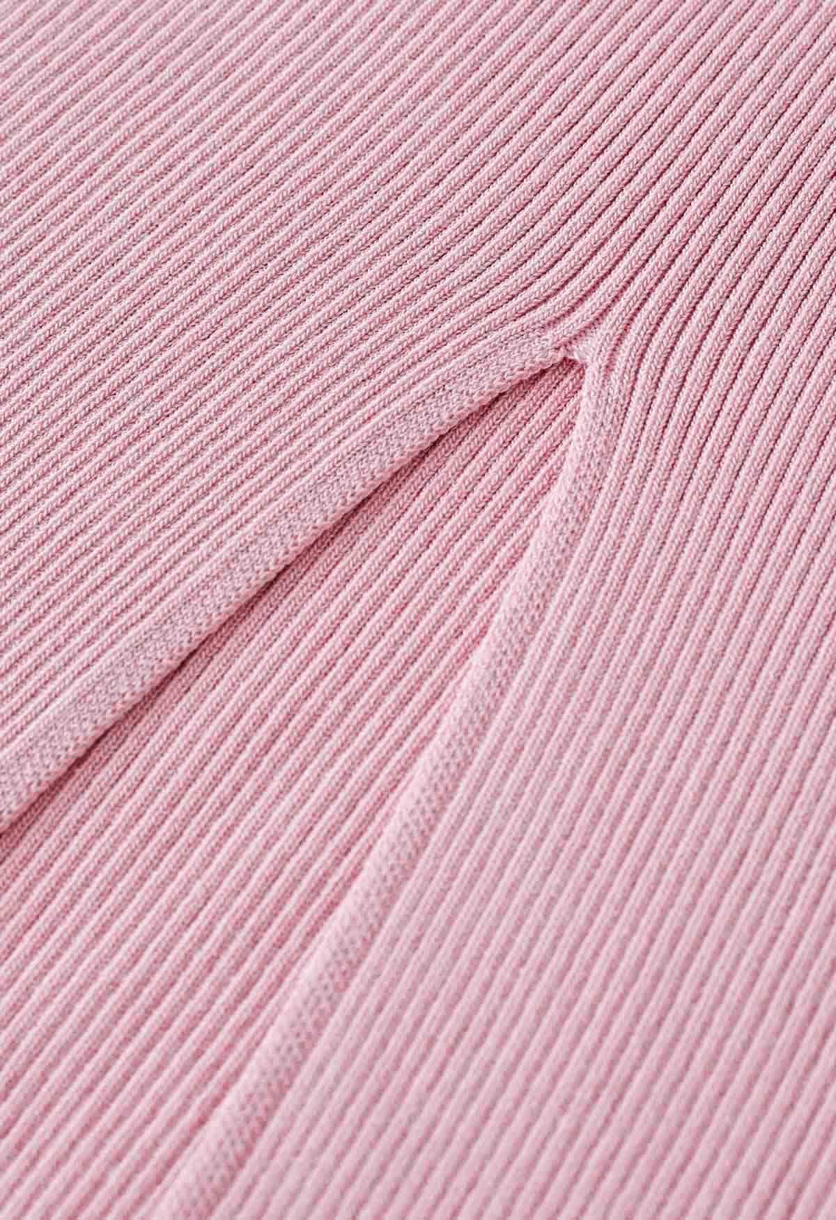 Robe caraco moulante en tricot torsadé sur le devant en rose