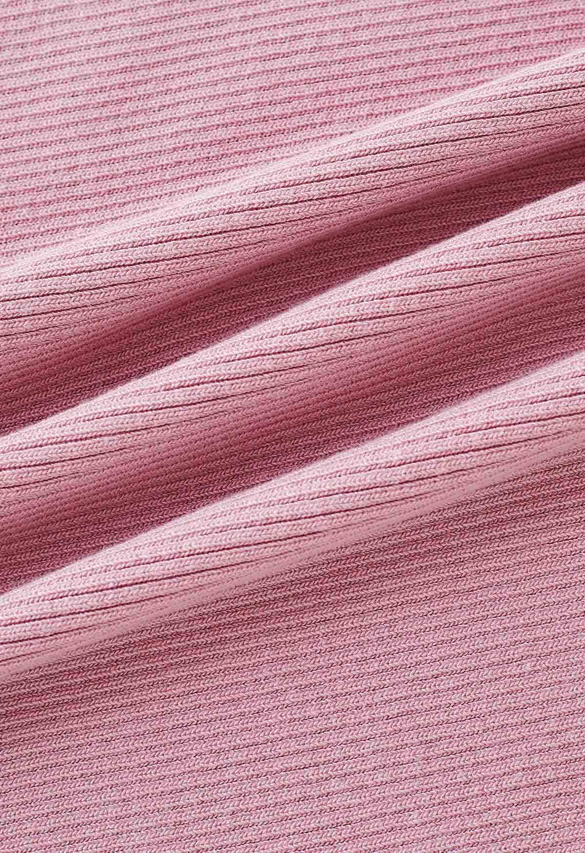 Robe caraco moulante en tricot torsadé sur le devant en rose