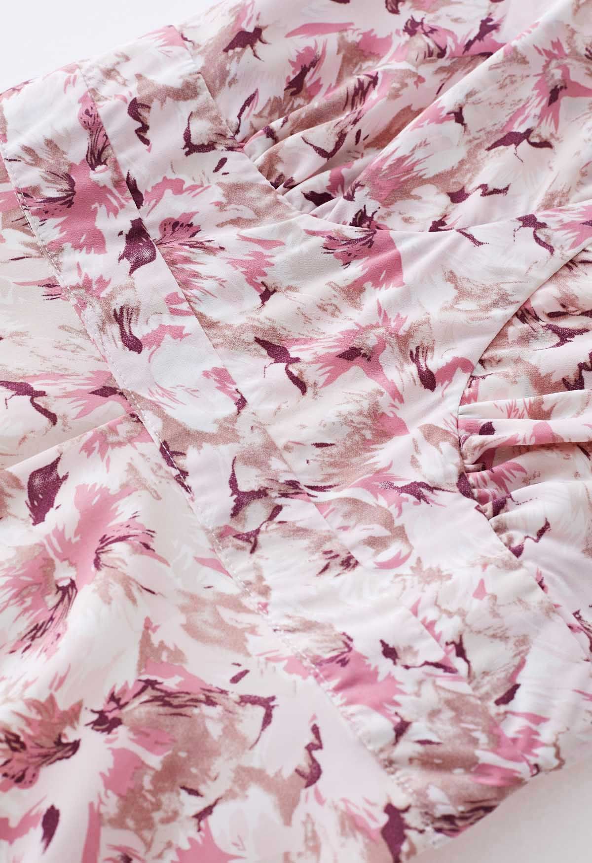 Robe mi-longue croisée à imprimé floral et dos ouvert en rose