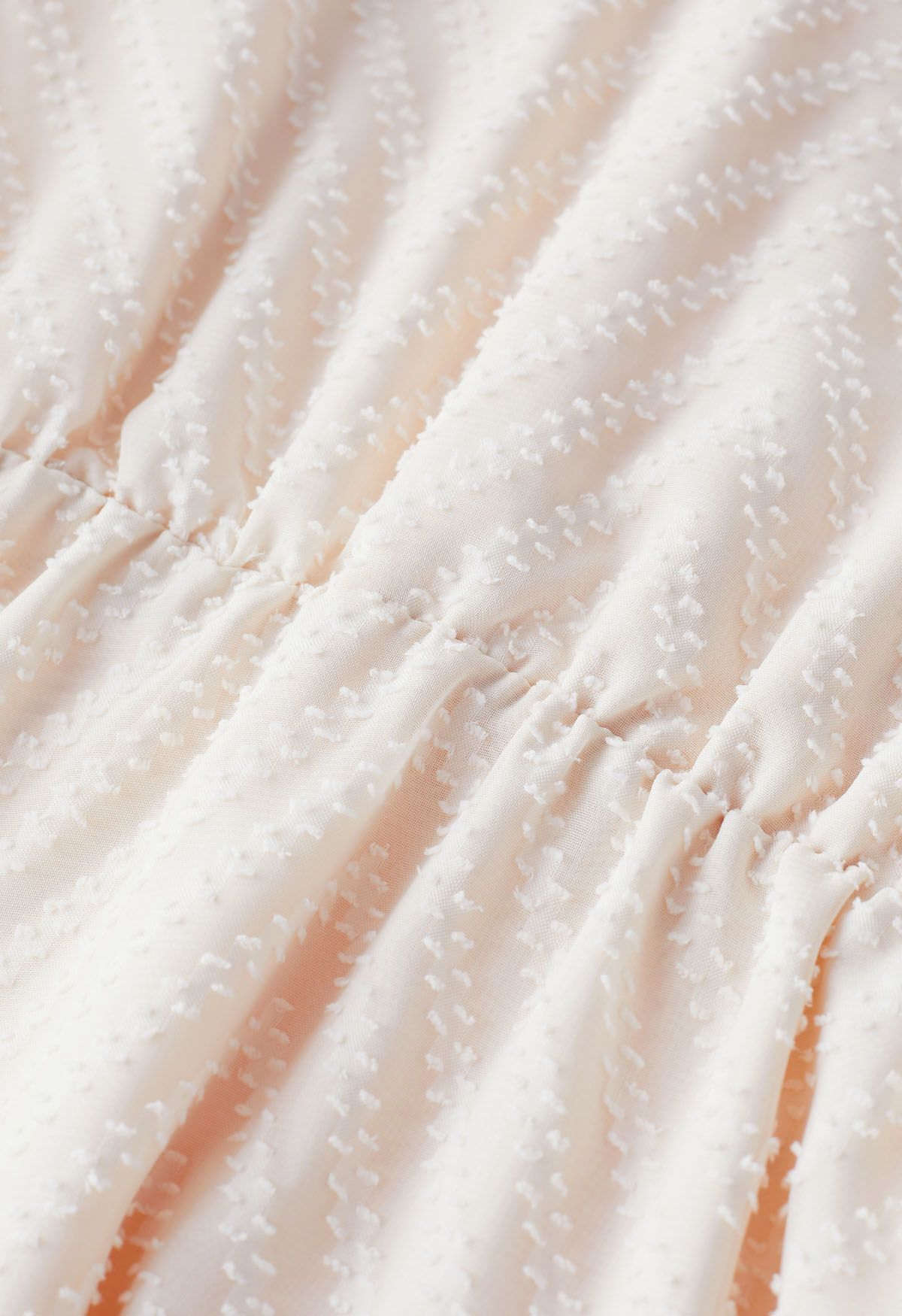 Haut cache-cœur à taille nouée à pois floqué en zigzag en crème