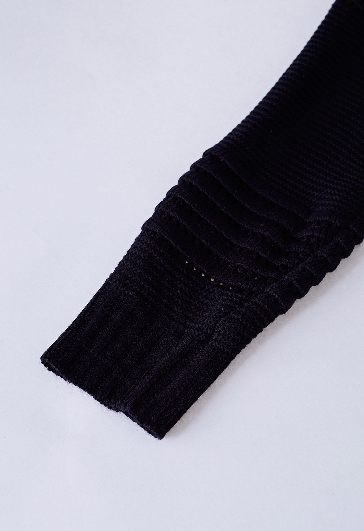 Pull en maille ajourée gaufrée à rayures en noir