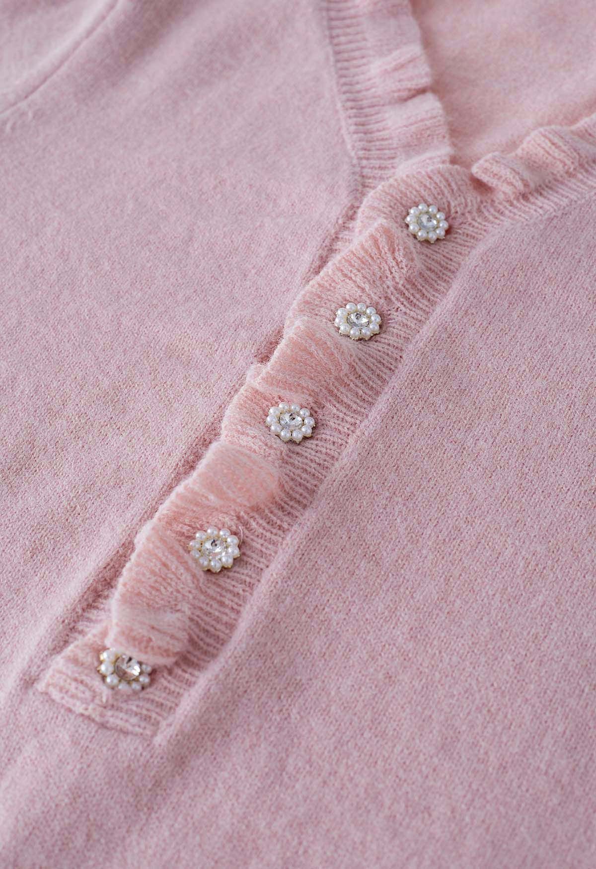 Pull en tricot boutonné sur le devant à volants en rose