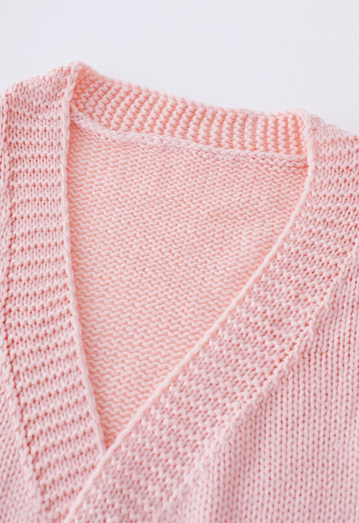 Cardigan en tricot ouvert sur le devant à fleurs en point 3D en rose