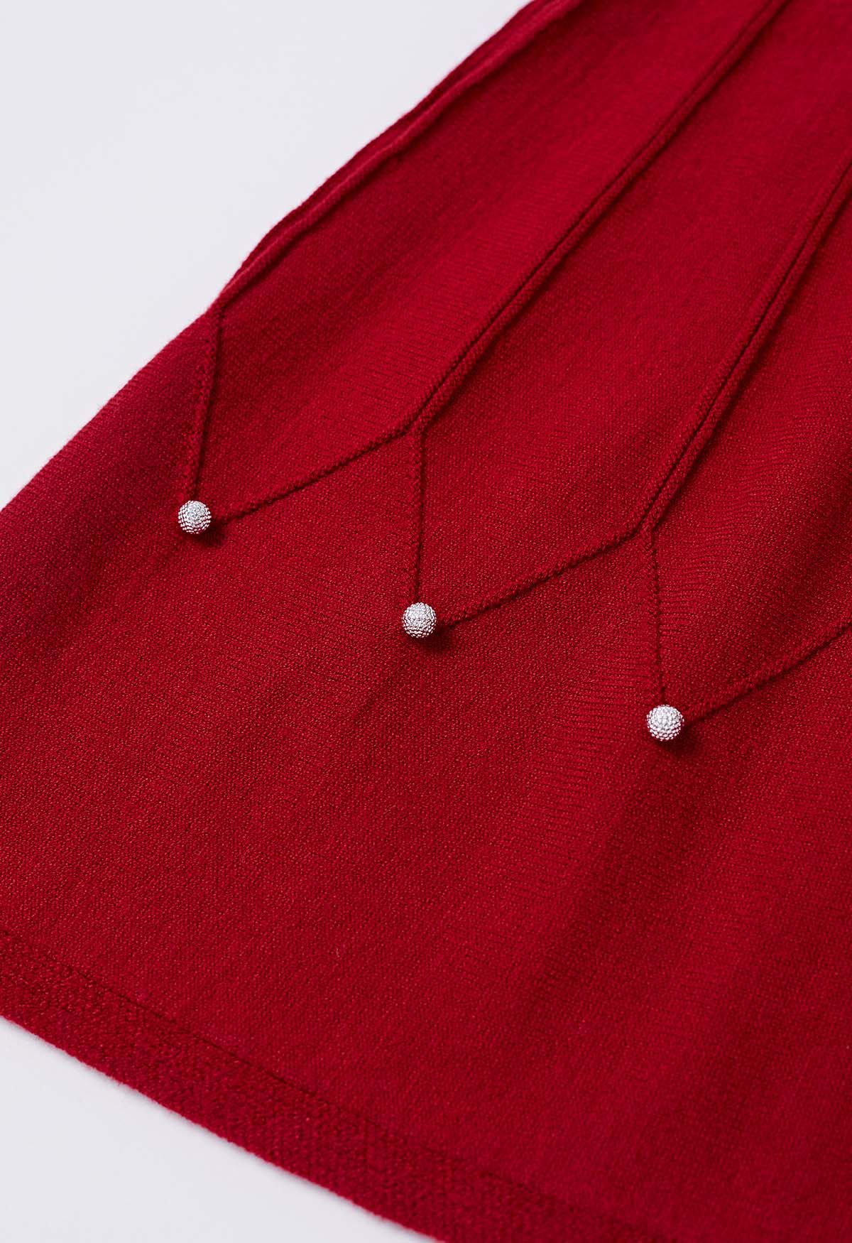 Jupe en tricot à coutures ornées de perles argentées en rouge