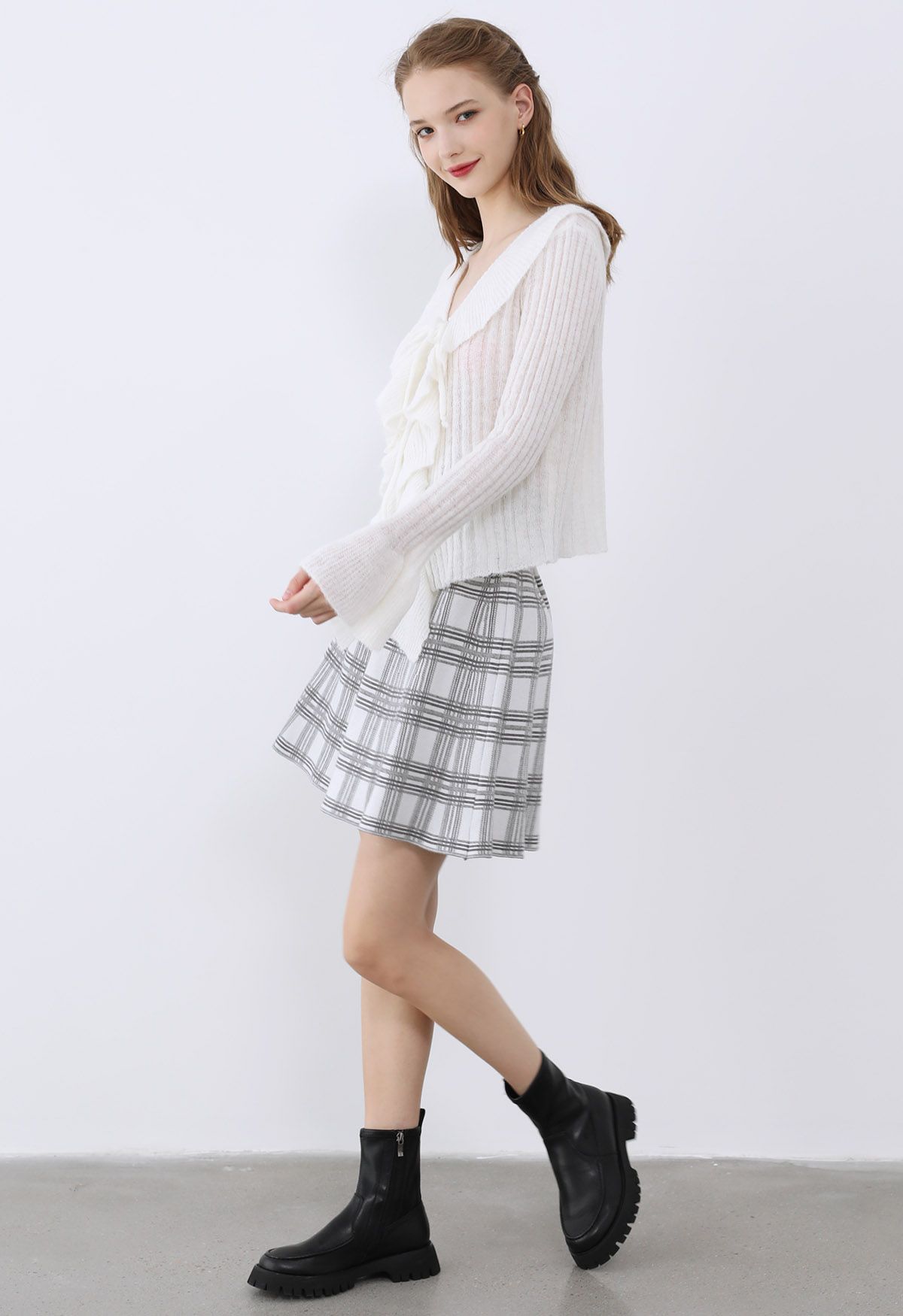 Mini-jupe taille haute en tricot à carreaux en gris
