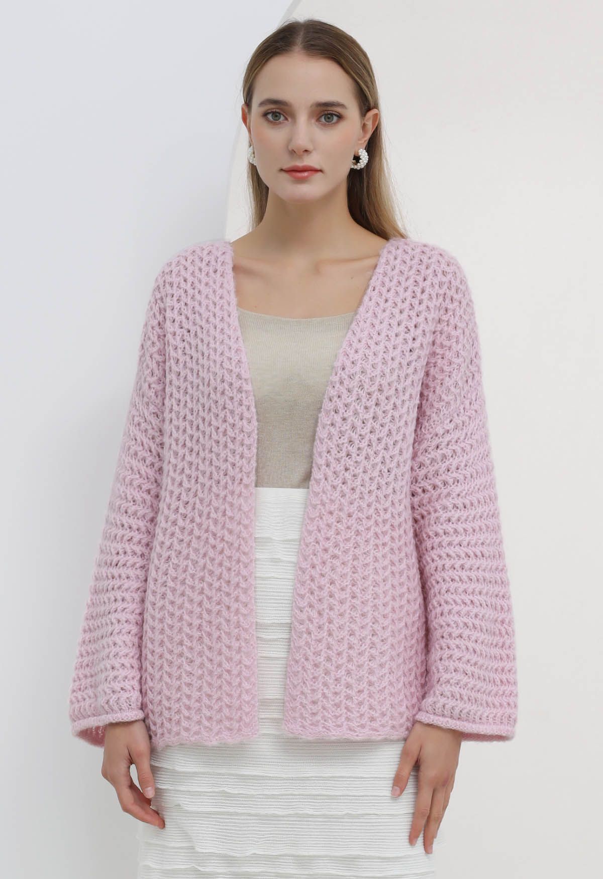 Cardigan en maille ajouré ouvert sur le devant en rose