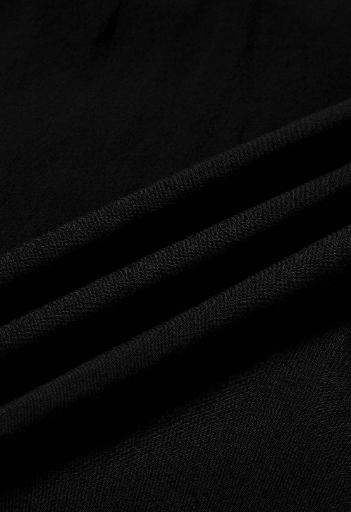 Chemise à col en V et taille croisée en noir