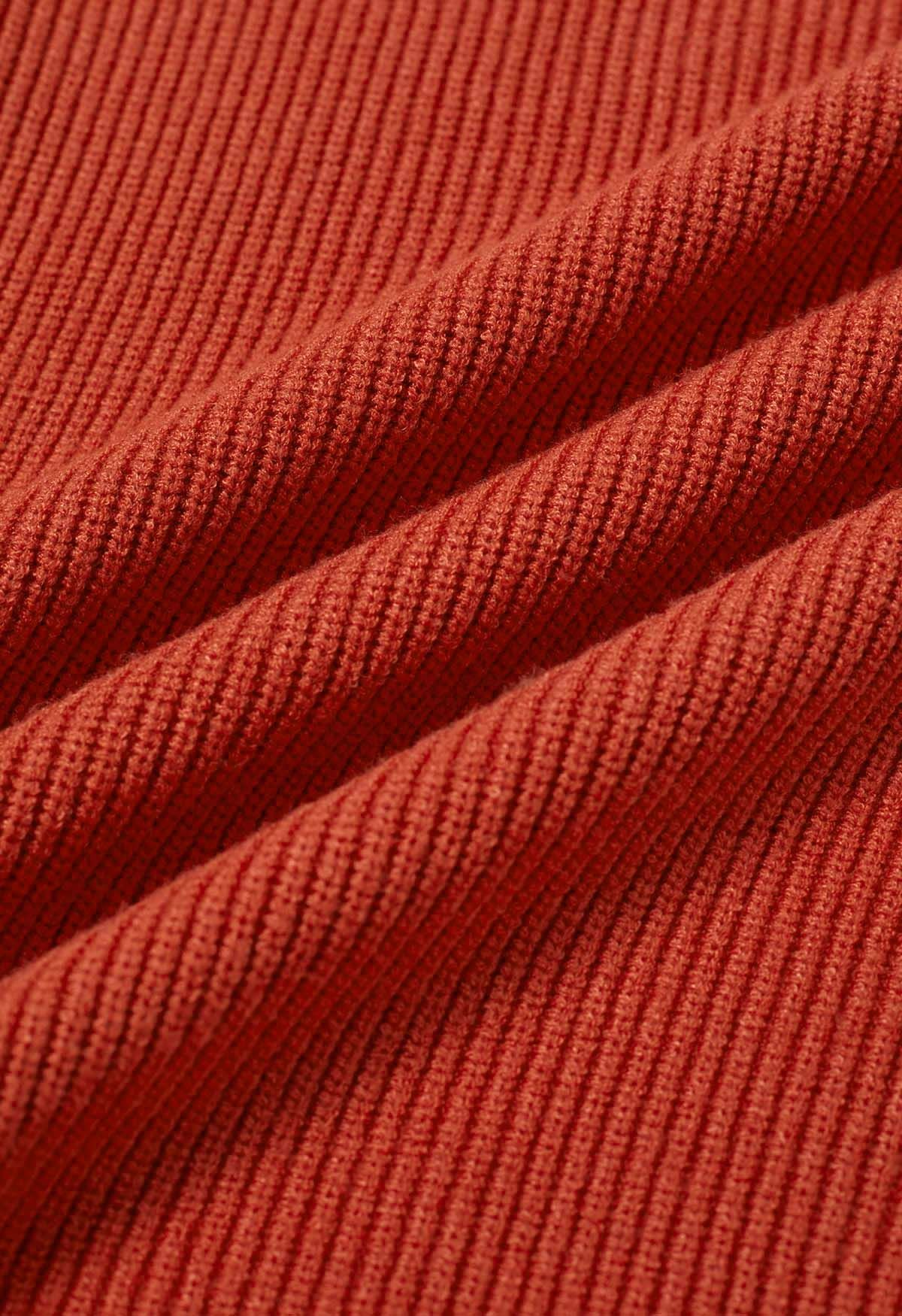Pull en tricot côtelé à poche plaquée en rouge rouille
