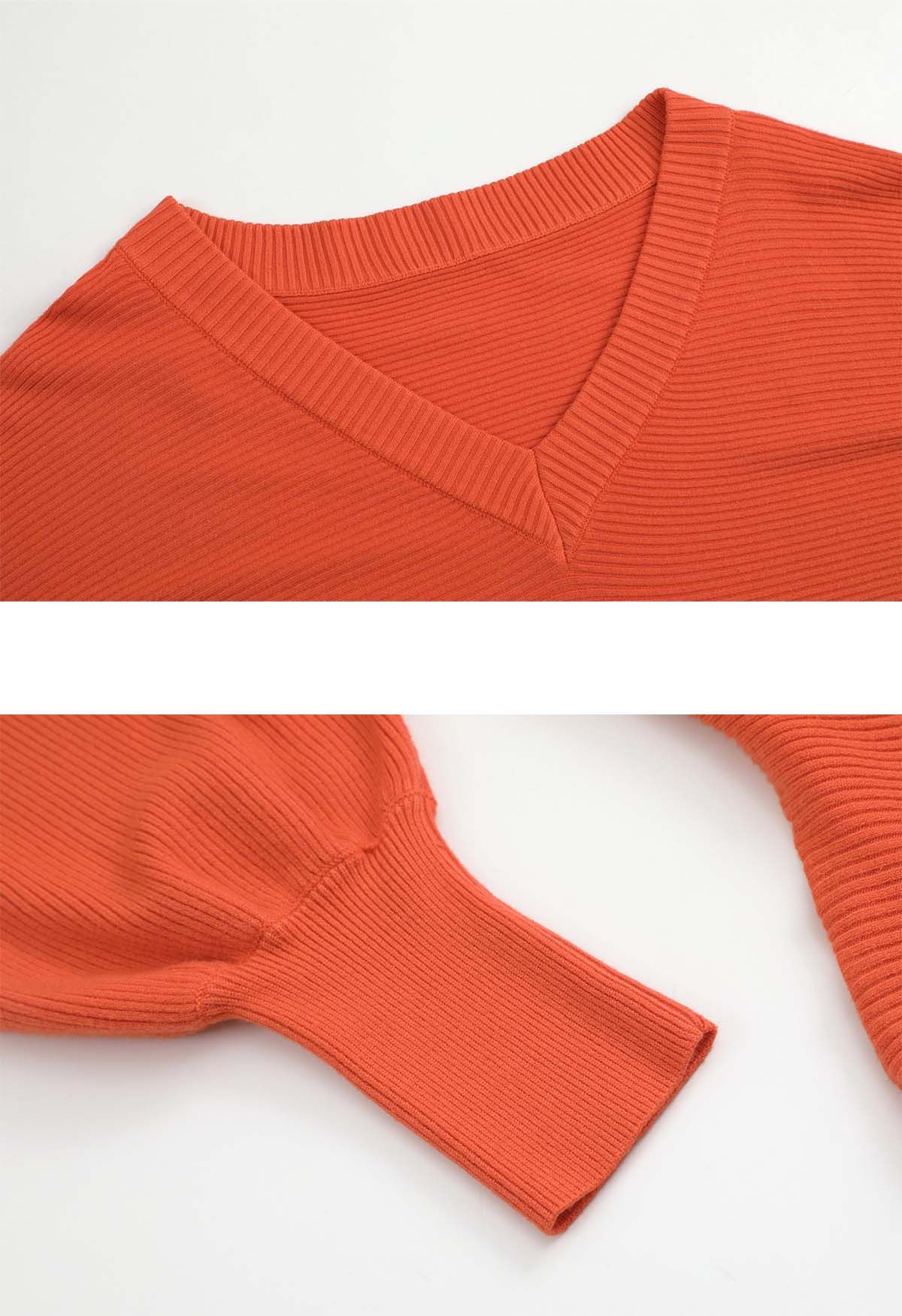 Pull en tricot à col en V et manches chauve-souris en orange