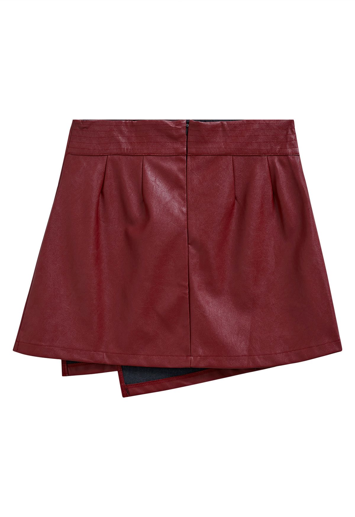Mini-jupe en similicuir à ourlet irrégulier en rouge