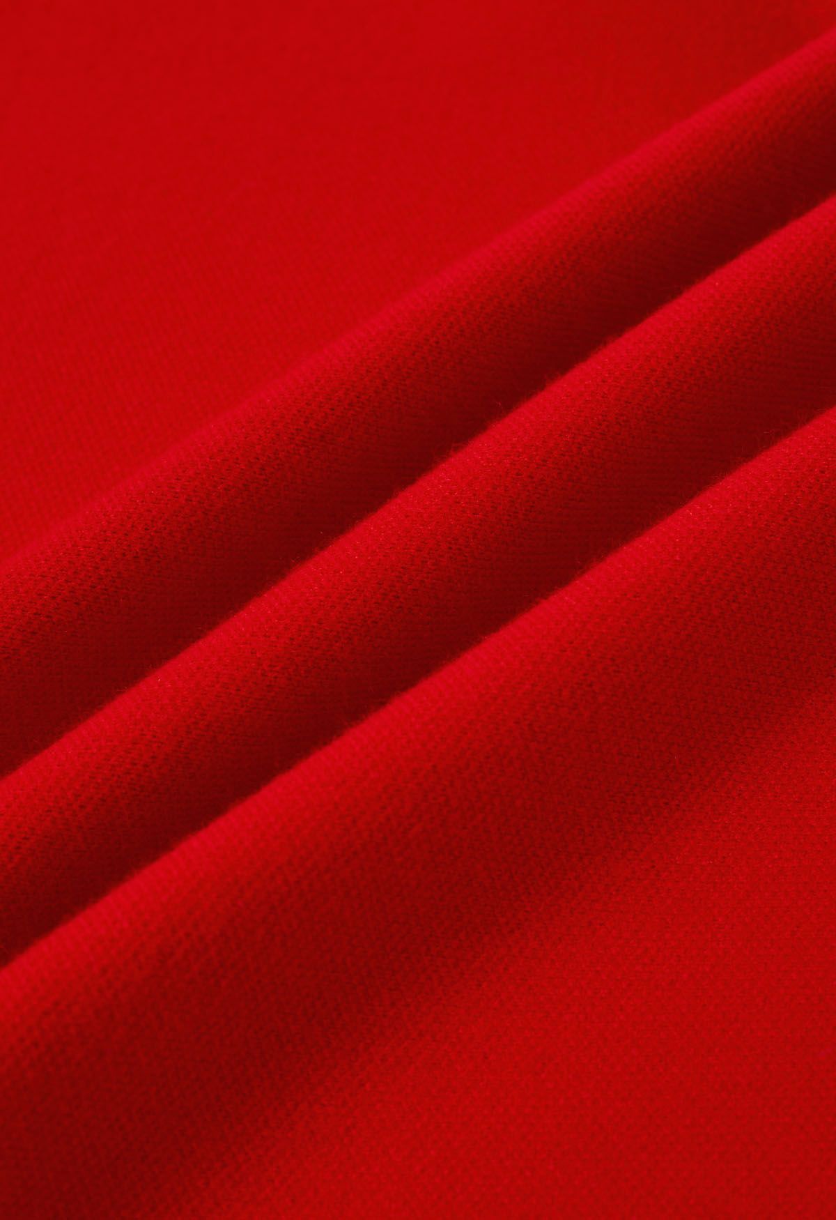 Poncho en tricot à ourlet fendu et manches en fausse fourrure en rouge