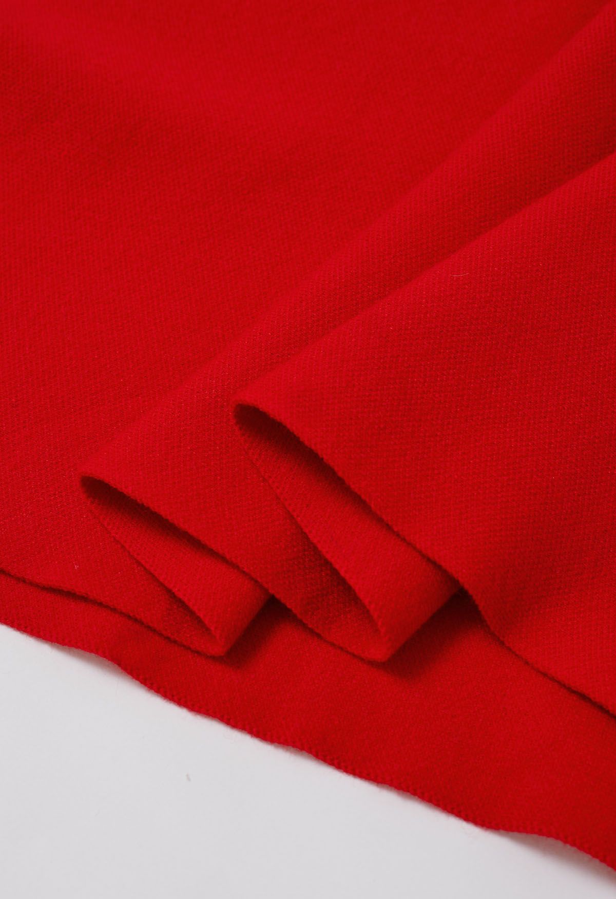 Poncho en tricot à ourlet fendu et manches en fausse fourrure en rouge
