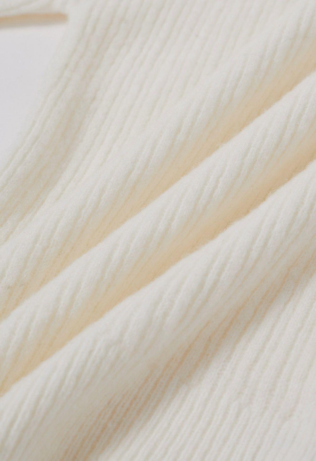 Haut en tricot ajusté à épaules dénudées avec joint torique en crème