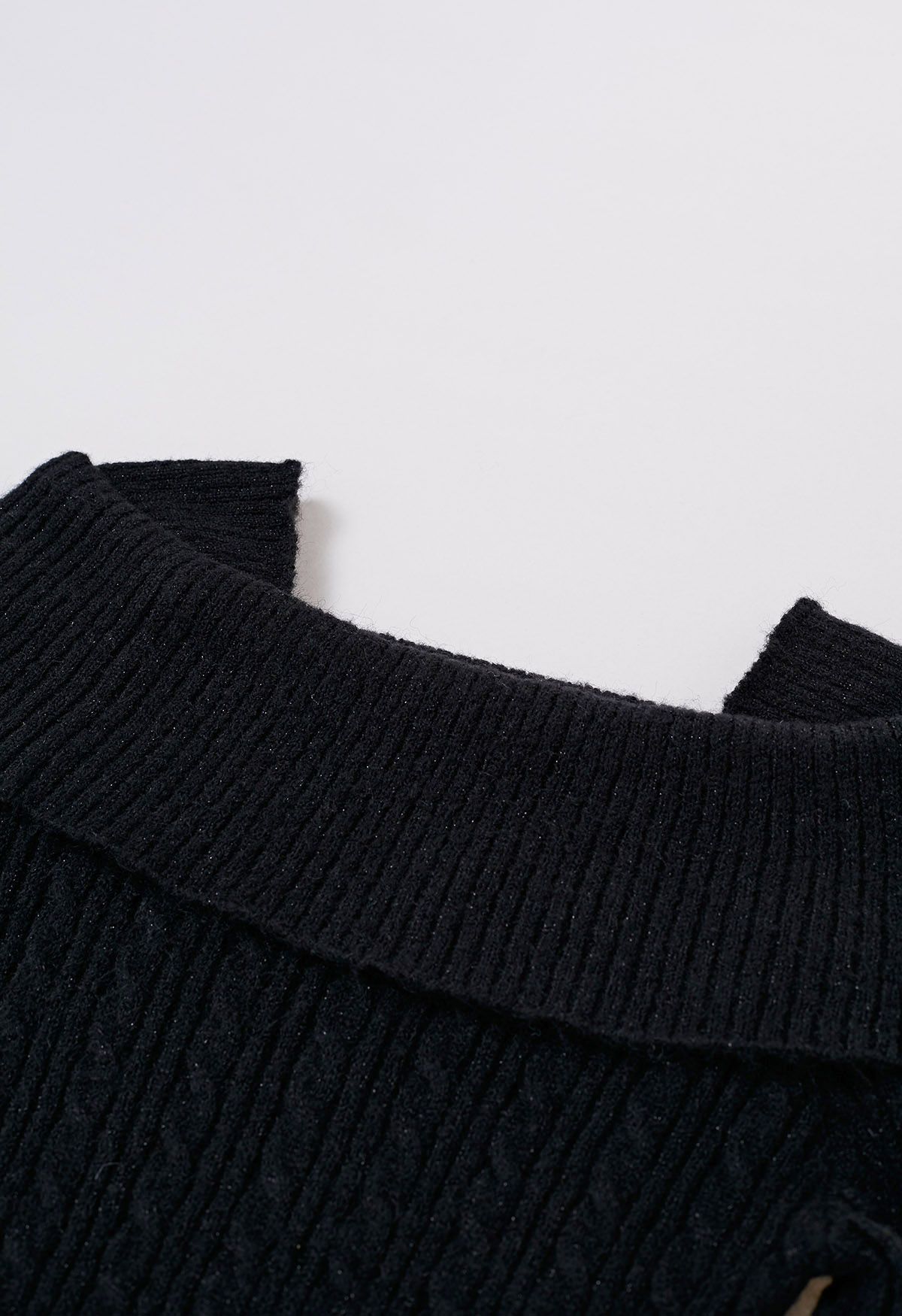Haut en tricot torsadé à épaules pliées en noir