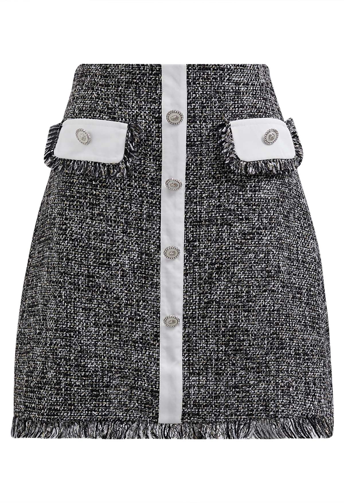Mini-jupe boutonnée en tweed à franges et boutons