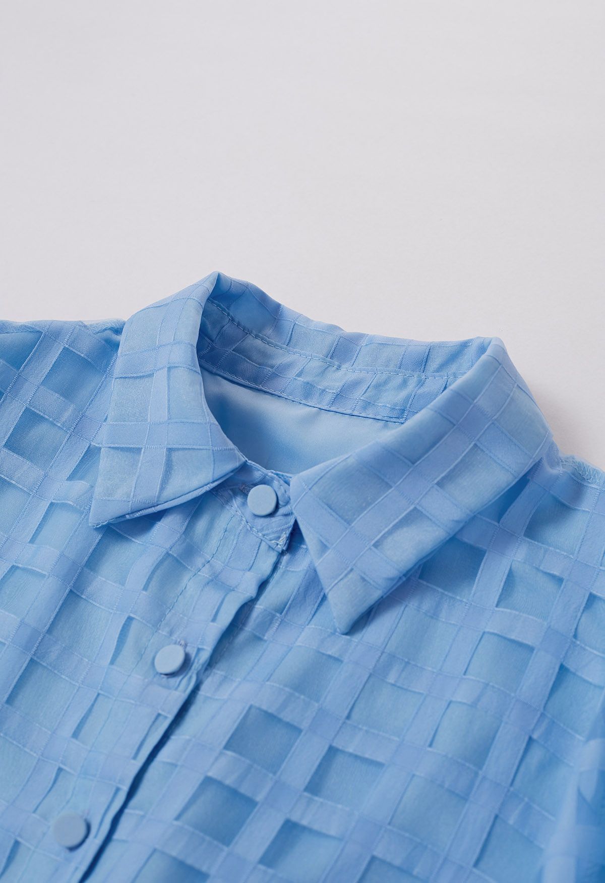 Chemise boutonnée à motif à carreaux en bleu