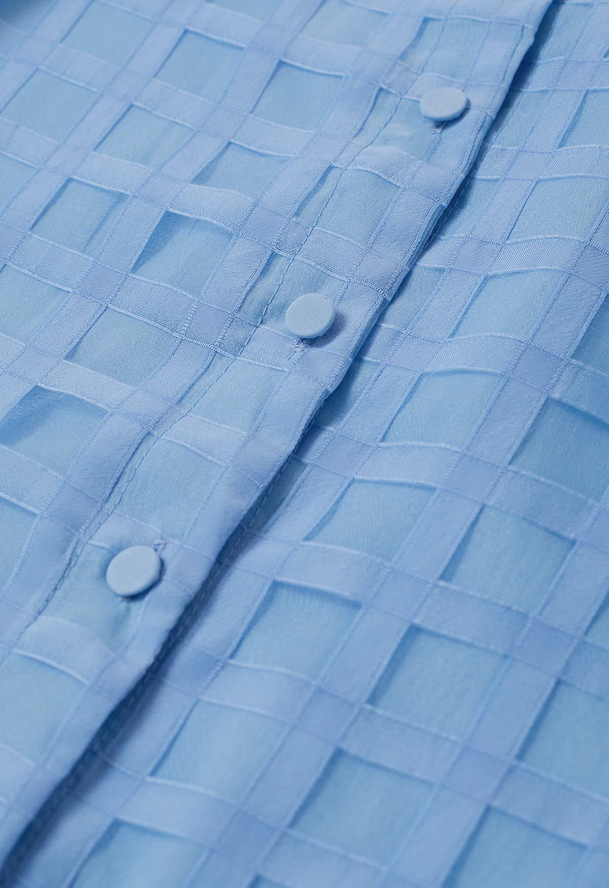 Chemise boutonnée à motif à carreaux en bleu