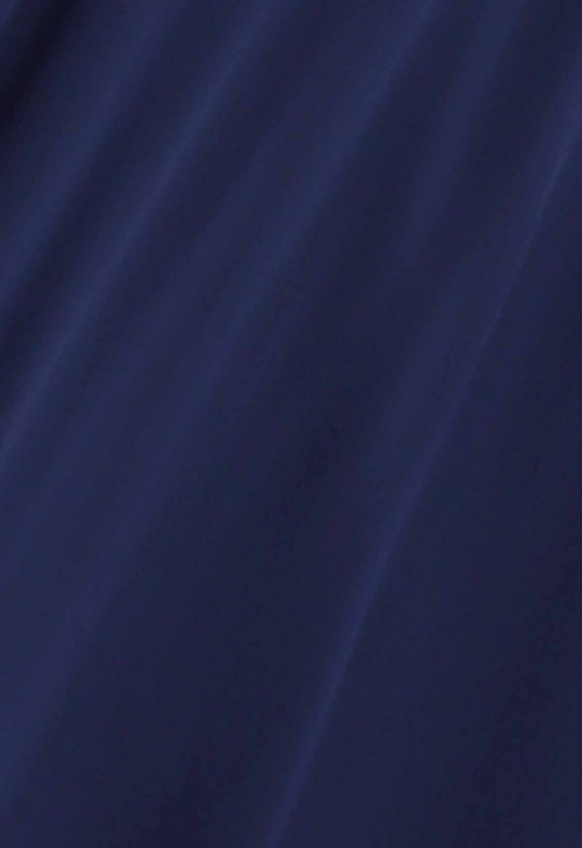 Robe longue en mousseline de soie à col en V et sequins exquis en bleu marine
