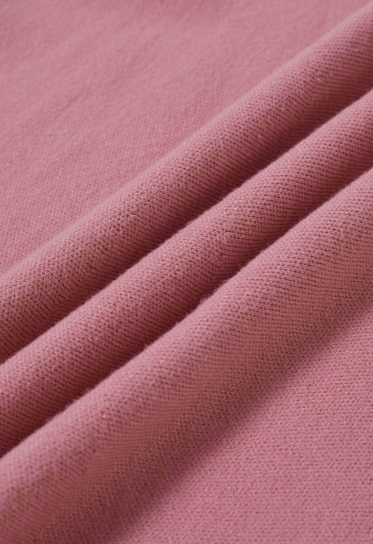 Jupe mi-longue en tricot à ourlet volanté en rose