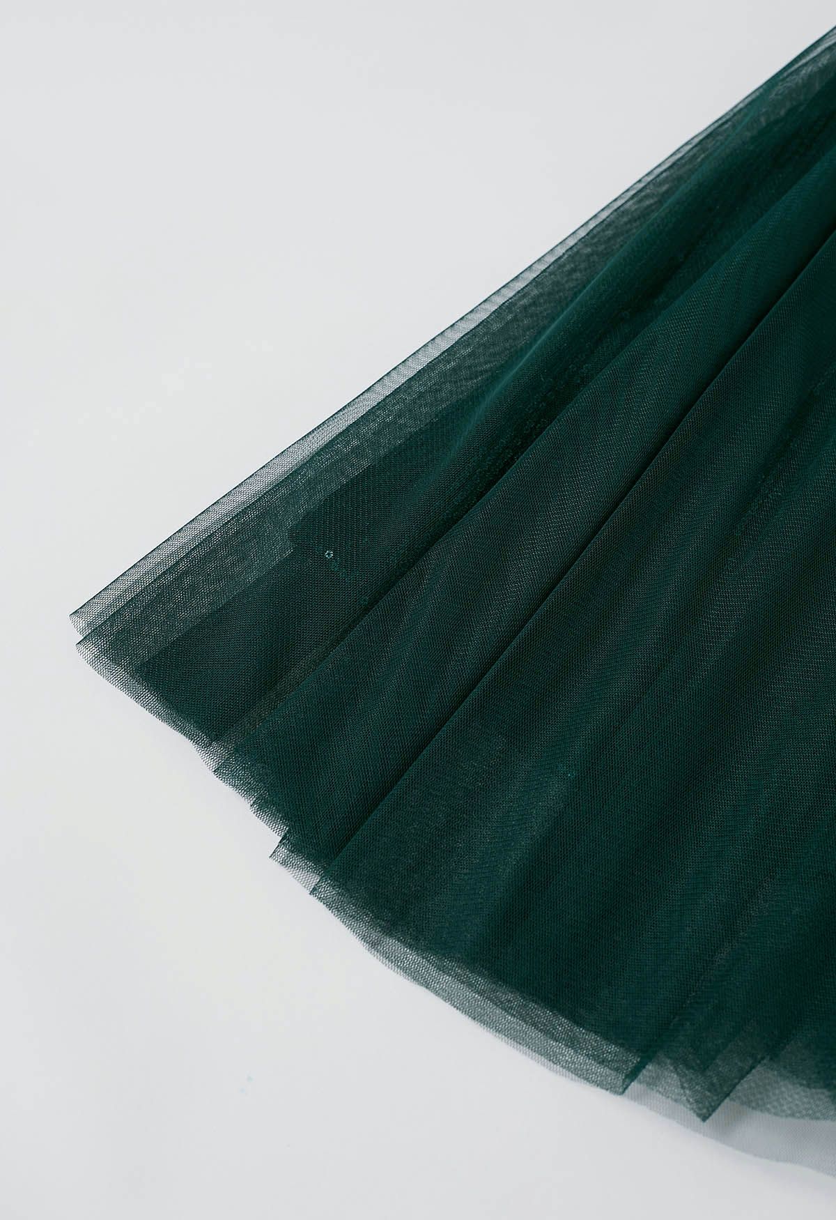 Ravissante jupe mi-longue en tulle et maille à sequins, vert foncé