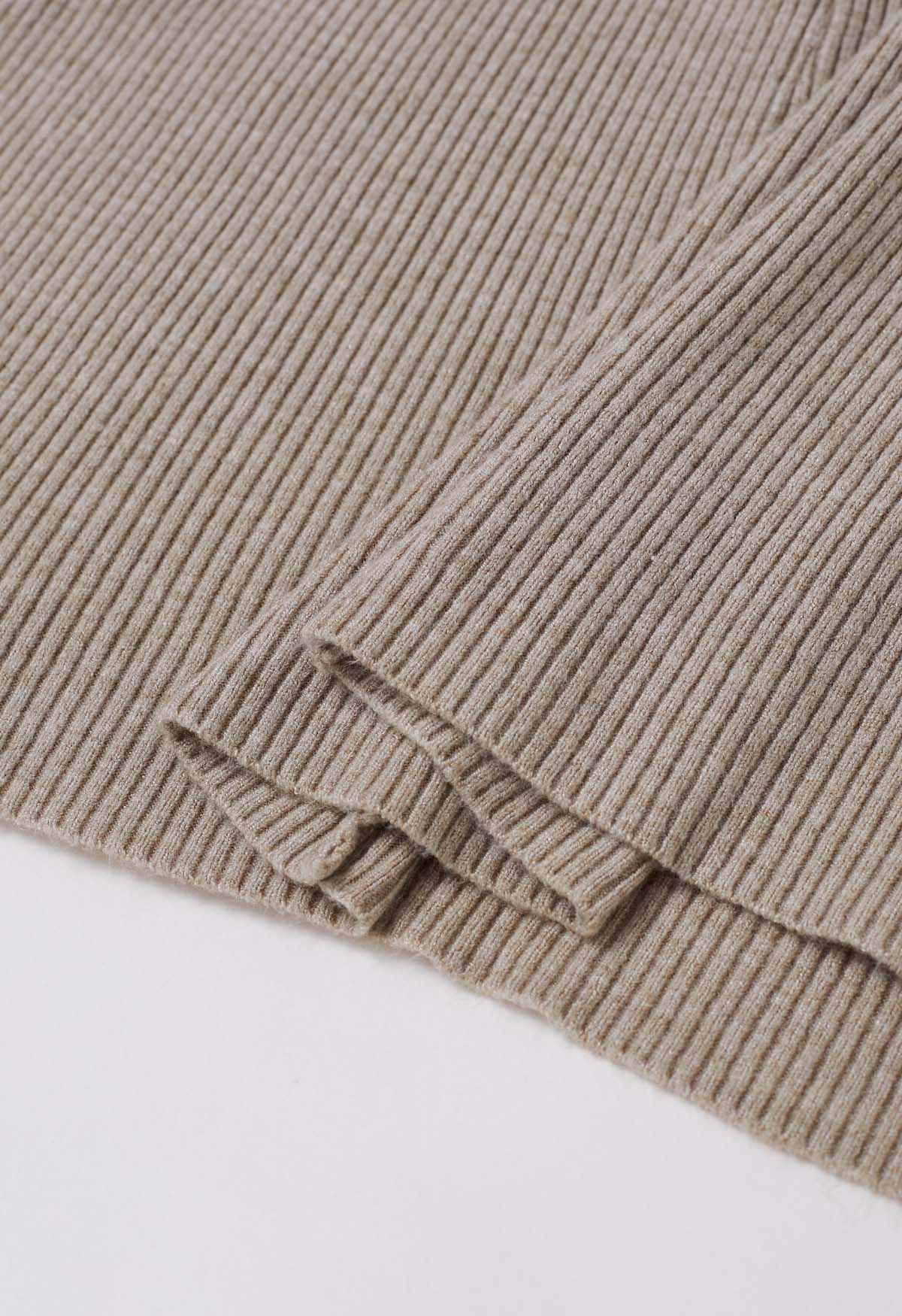 Robe en tricot effet portefeuille à taille croisée en avoine