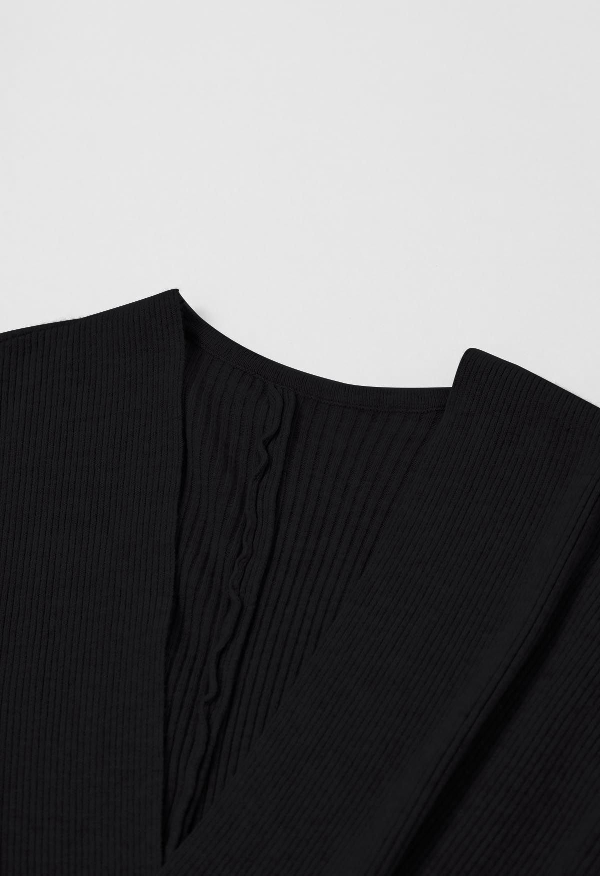 Robe en tricot effet portefeuille à taille croisée en noir
