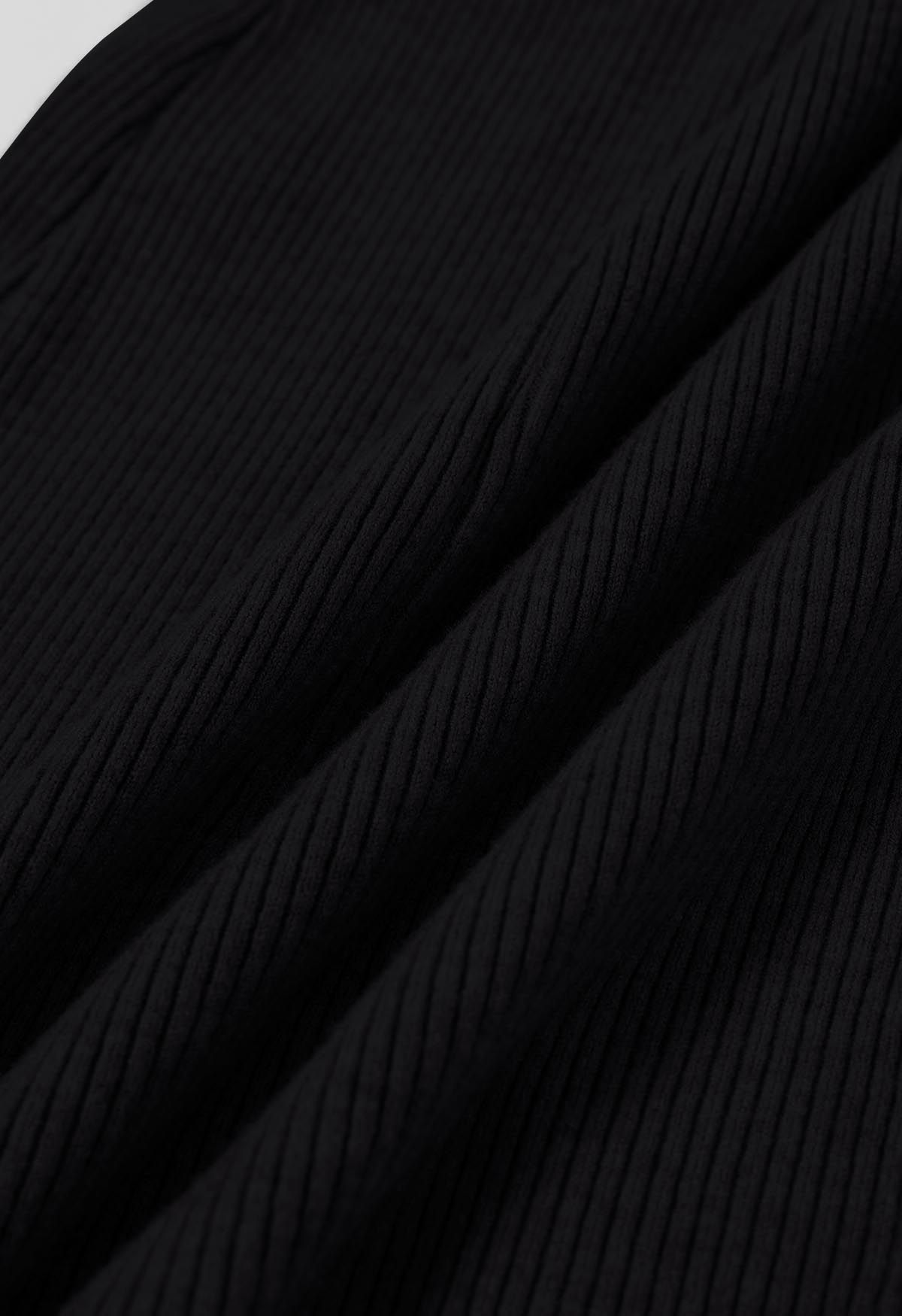 Robe en tricot effet portefeuille à taille croisée en noir
