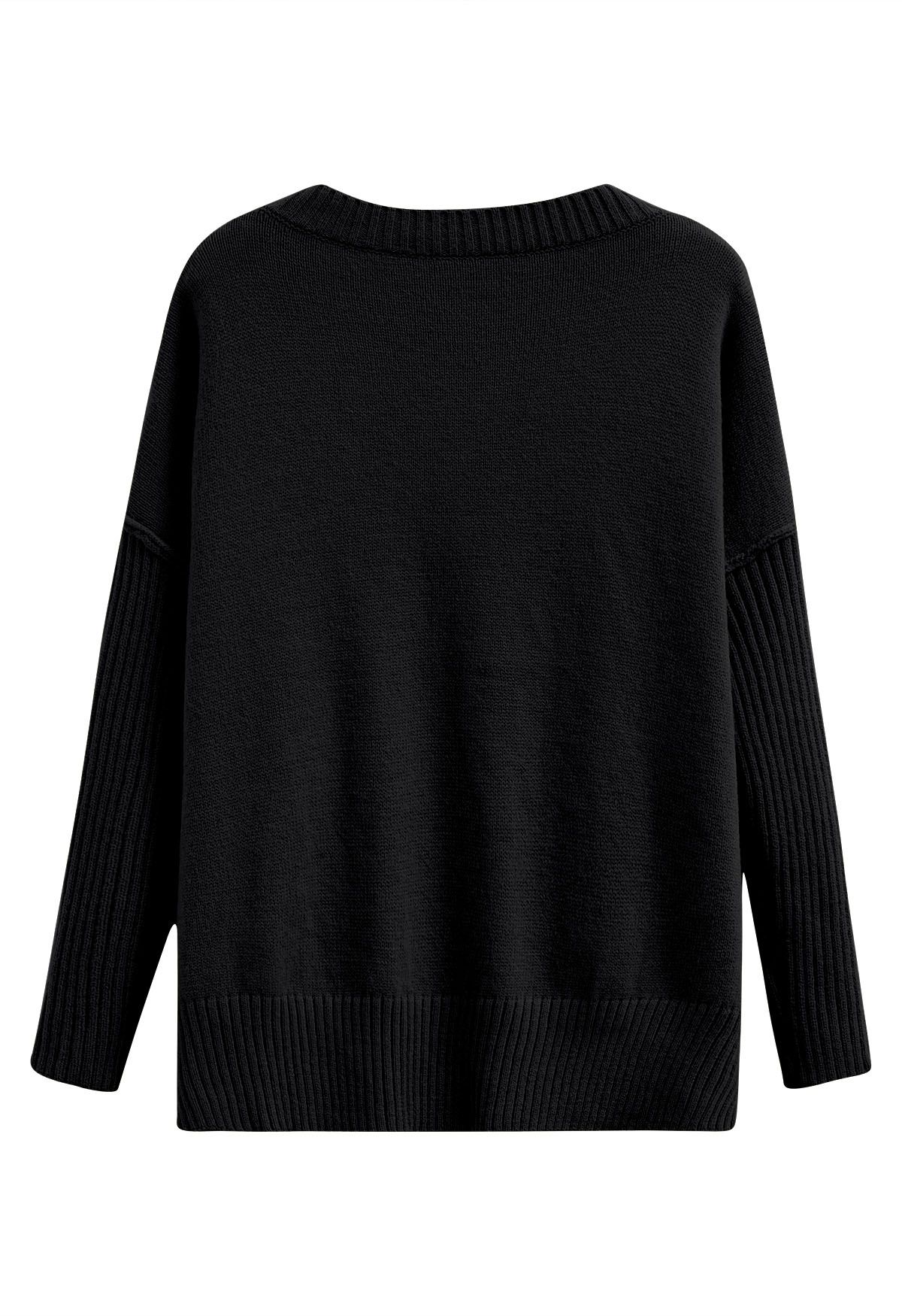 Pull en tricot ample à épaules tombantes et fente latérale en noir